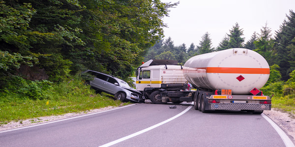 Collision between truck and car on road. Reach out to Jebaily Law Firm for legal help with your truck accident case.