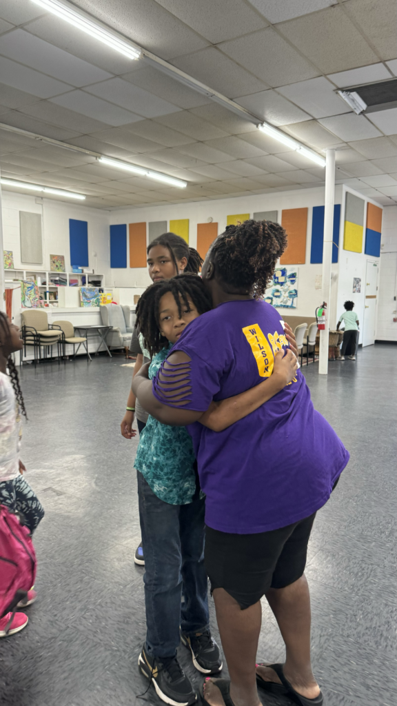 two people sharing a hug