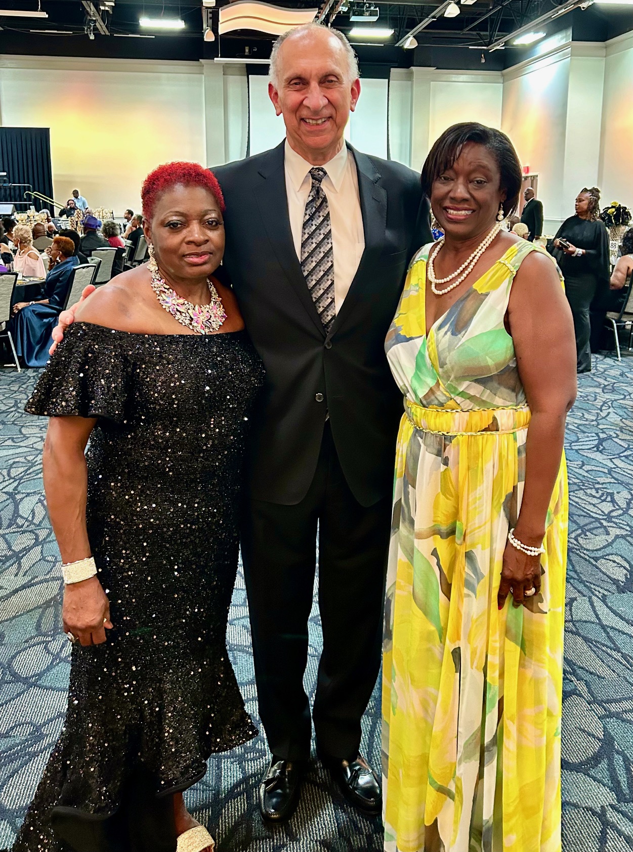 George Jebaily with two other gala attendees dressed in evening formal wear
