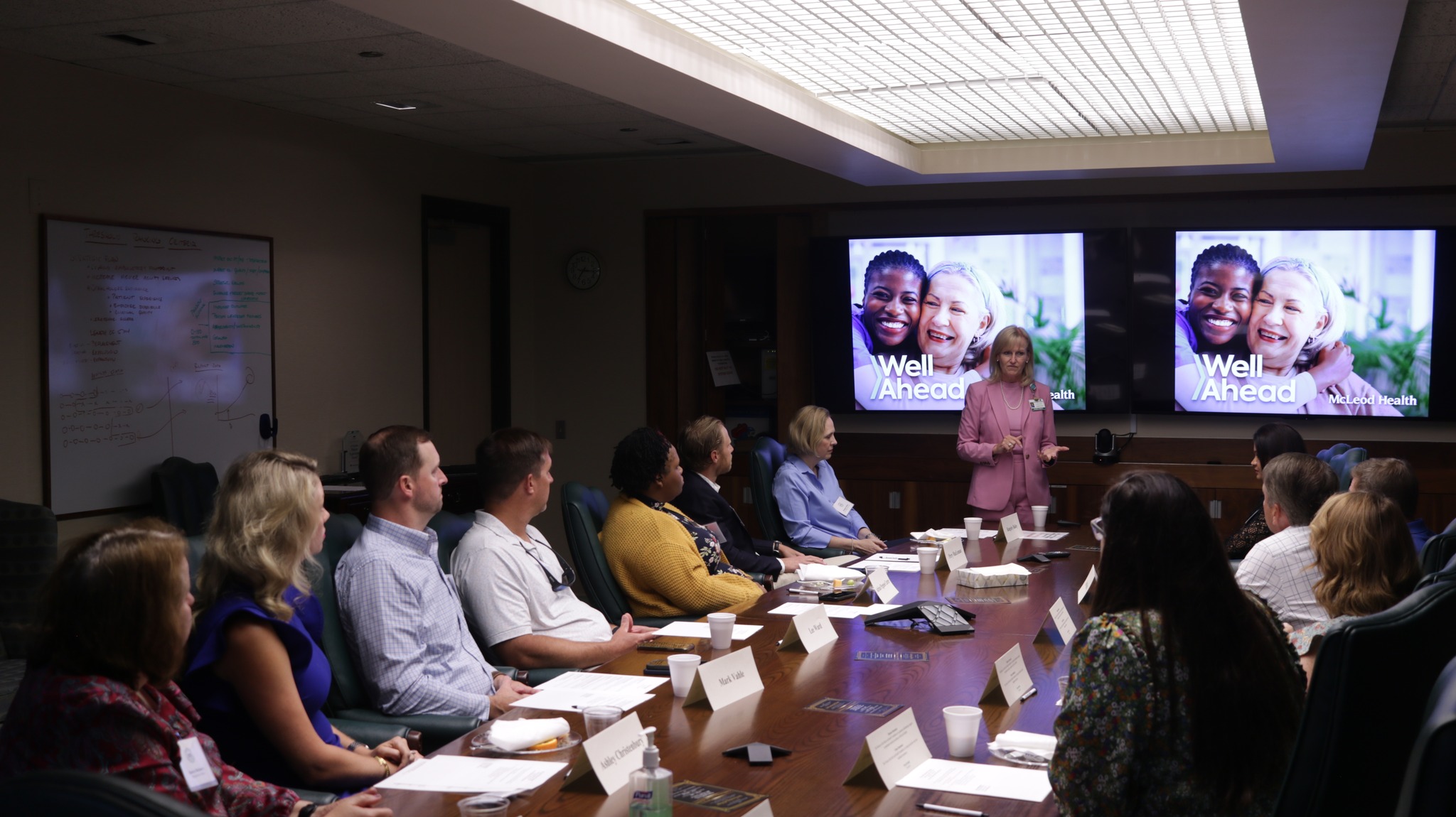 McLeod Fellows Class of 2025 seated at table watching presentation