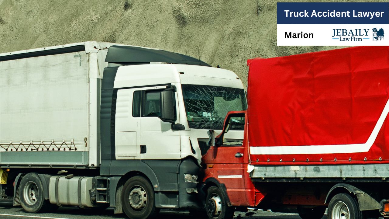 The image features a white truck and a red truck, likely involved in a situation that relates to transportation or logistics. It's associated with the JEBAILY Law Firm in Marion, which suggests a focus on legal services for truck accidents.