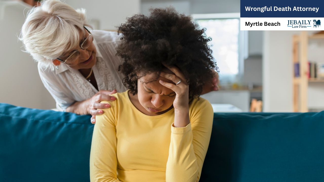 An older woman comforts a younger woman who is visibly distressed, creating a poignant scene of grief and support.