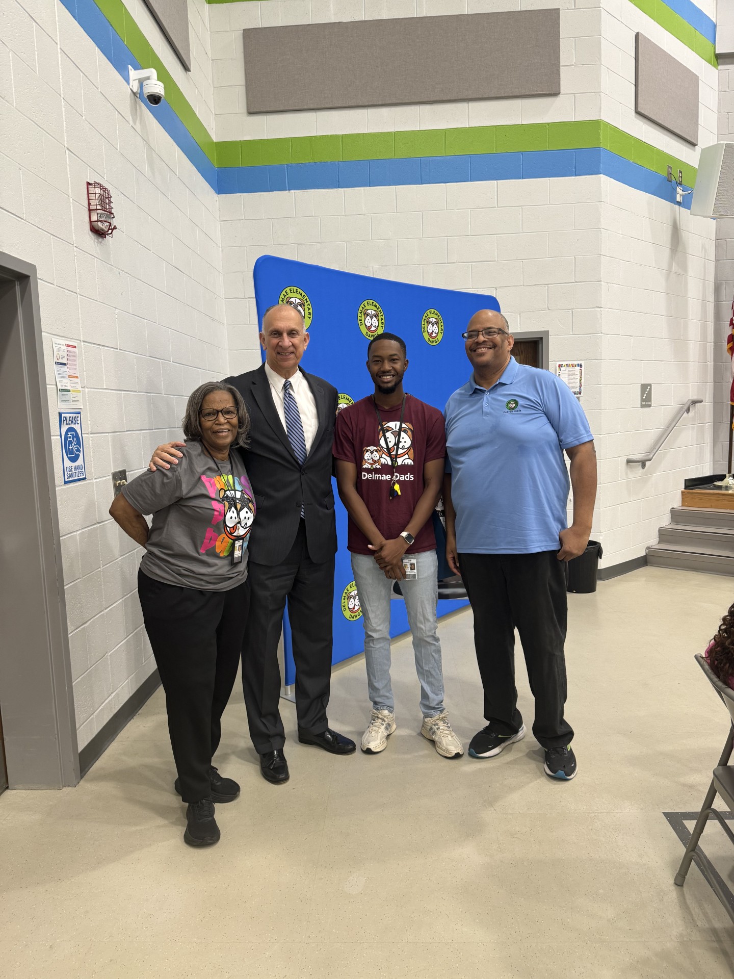 George Jebaily posing with staff from Delmae Heights Elementary at Dads Breakfast