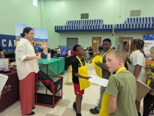 Attorney Kayla Jebaily Adams speaks with a group of elementary school children at a Career Day event