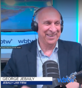 Man smiling white wearing headphones on Coffee with Cool People podcast