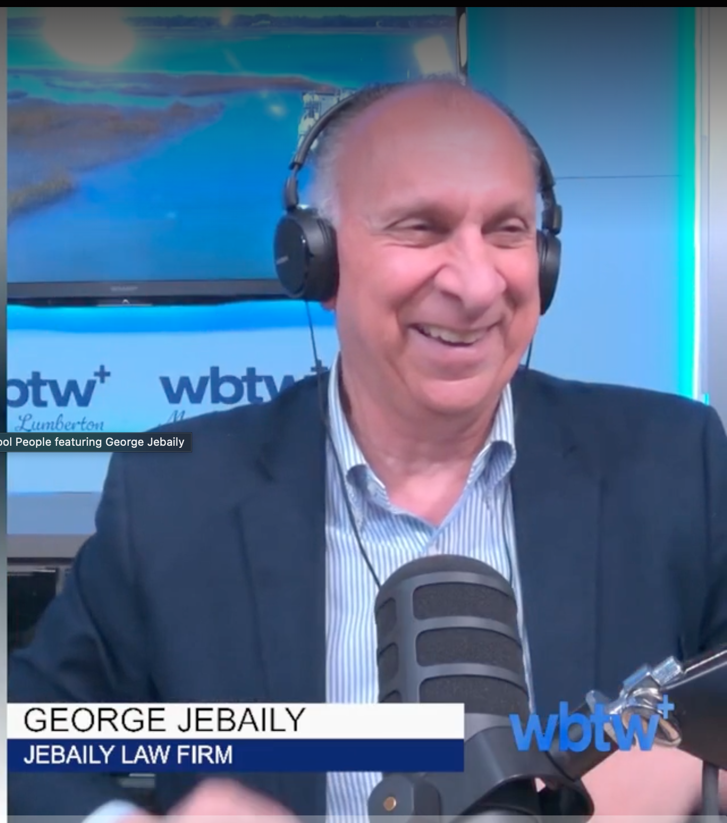 Man smiling white wearing headphones on Coffee with Cool People podcast