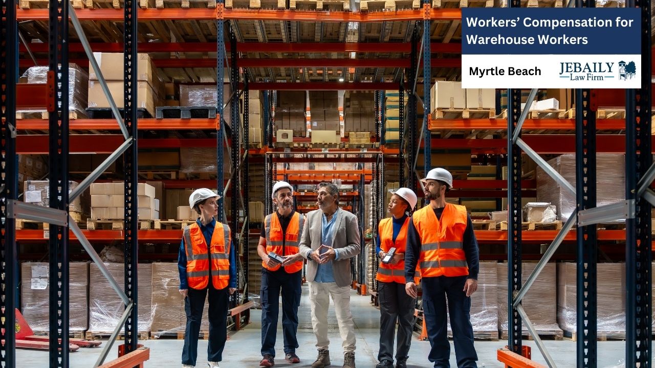 A group of diverse warehouse workers stand with a supervisor in a warehouse filled with tall shelves stacked with boxes.